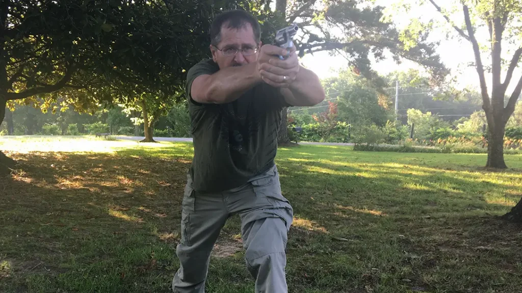 Finish the draw and get both hands on the gun.