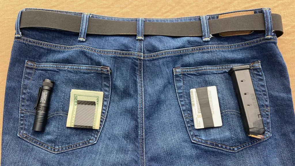 The author bisects his back pockets to create two pockets on each side of his concealed carry pants.