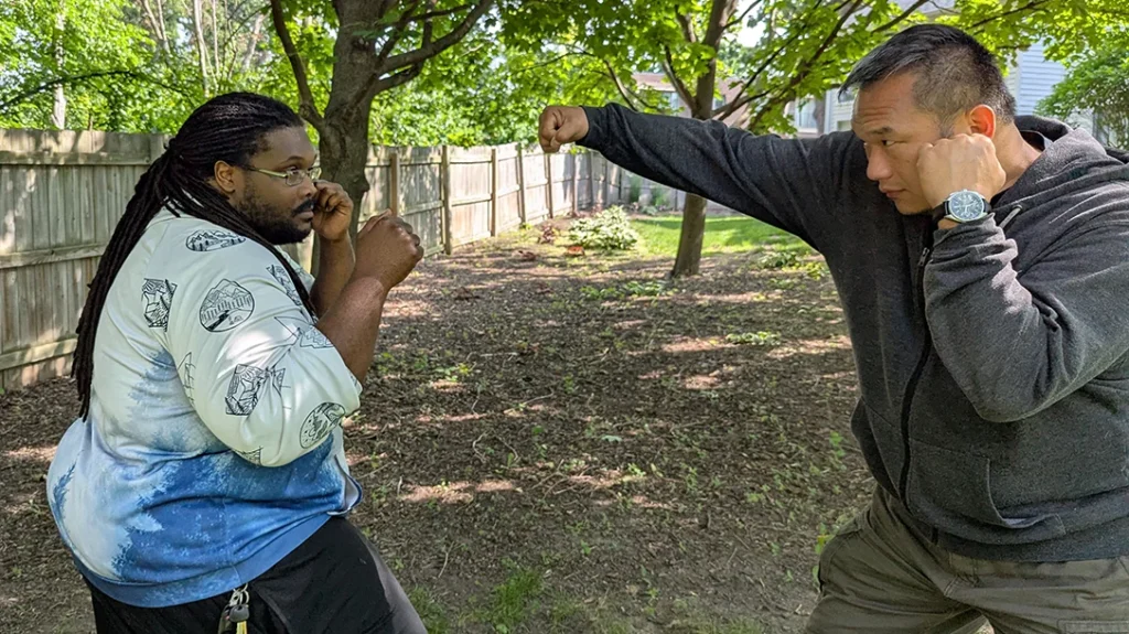 Sam attempts a right punch at Kysean.