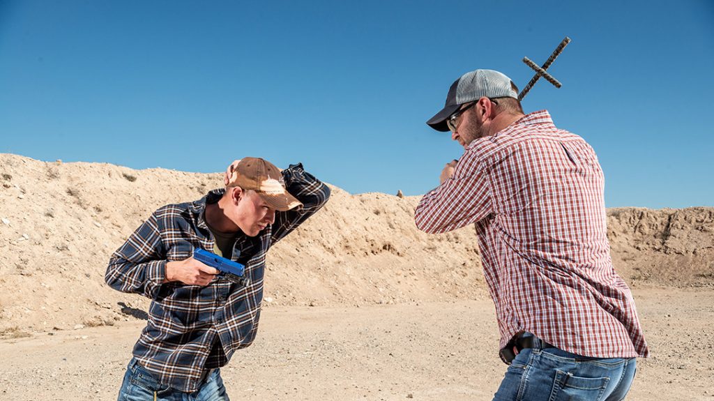 To protect your head from an overhand strike, the supportside arm comes up to shield you while you fire from a retention position. Try to create some distance after the initial shots to take your self-defense from close quarters to range.
