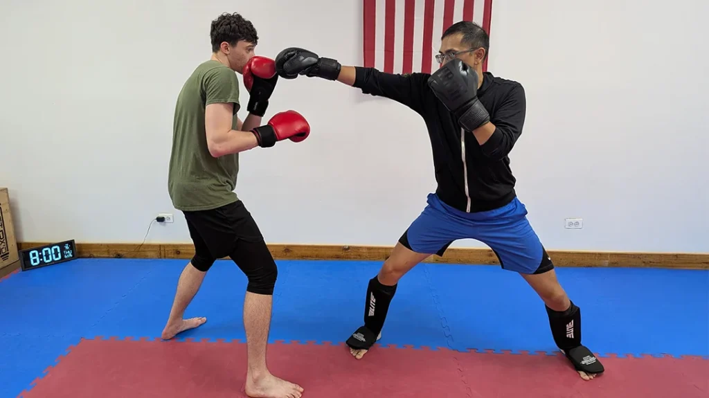 Defensive Footwork: Adam attempts a right punch (Angle 2) against Ben.