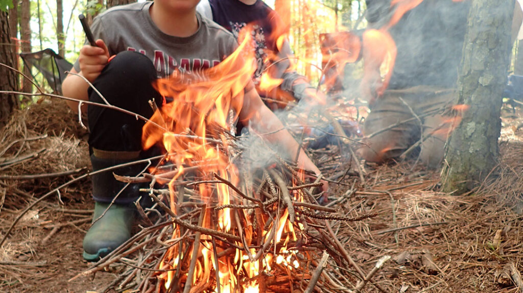 Teaching Kids Wilderness Survival: Firemaking skills are paramount. Make sure to supervise kids while making and extinguishing fires.