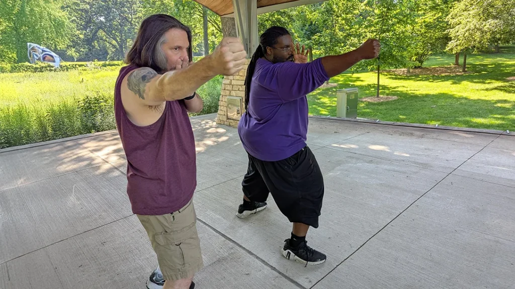 The Backfist: Both extend their punches that swing out at an angle like a door instead of straight forward like a western jab.