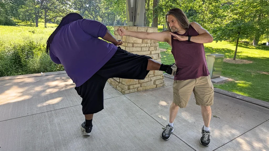 You open your ribcage up to counter strikes like a sidekick when you throw a backfist. So, snap it back to your guard as fast as you can and protect your ribs.