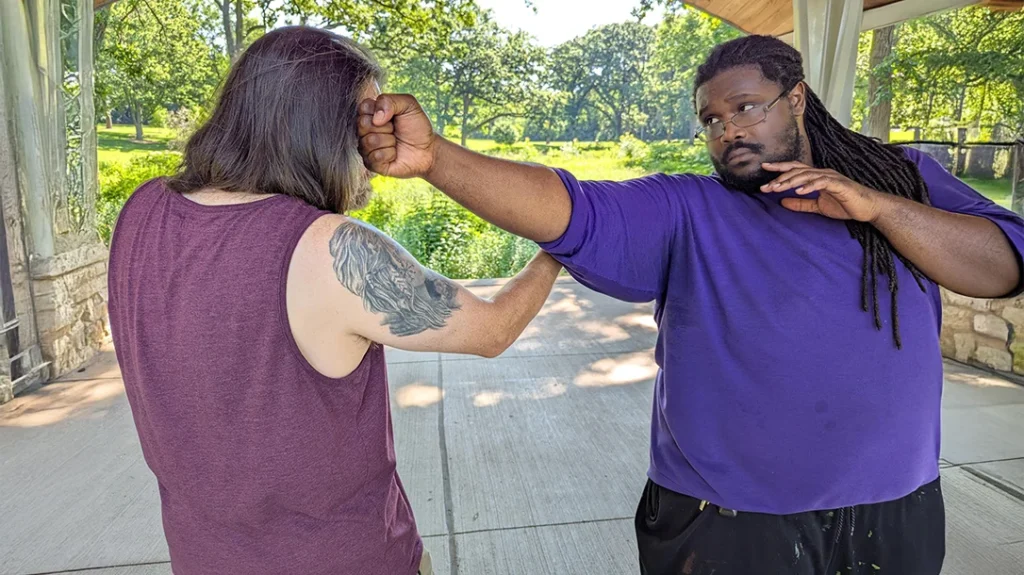 Since Kysean could touch Don's arm, he was able to reach his target with his backfist with ease.