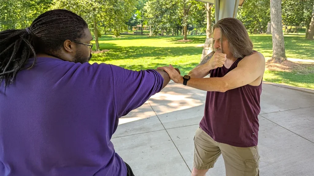 The Backfist: Don Traps/ Slaps and rolls Kysean’s punch downward.