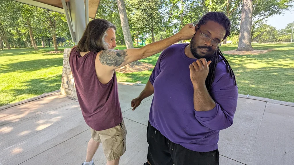 Don has now closed the gap and is able to connect with his backfist.