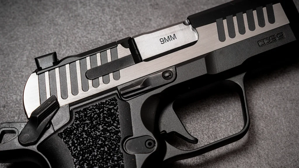 Key Kimber CDS9 Classic differences include the simpler slide serrations, smooth front strap, and polymer grips.