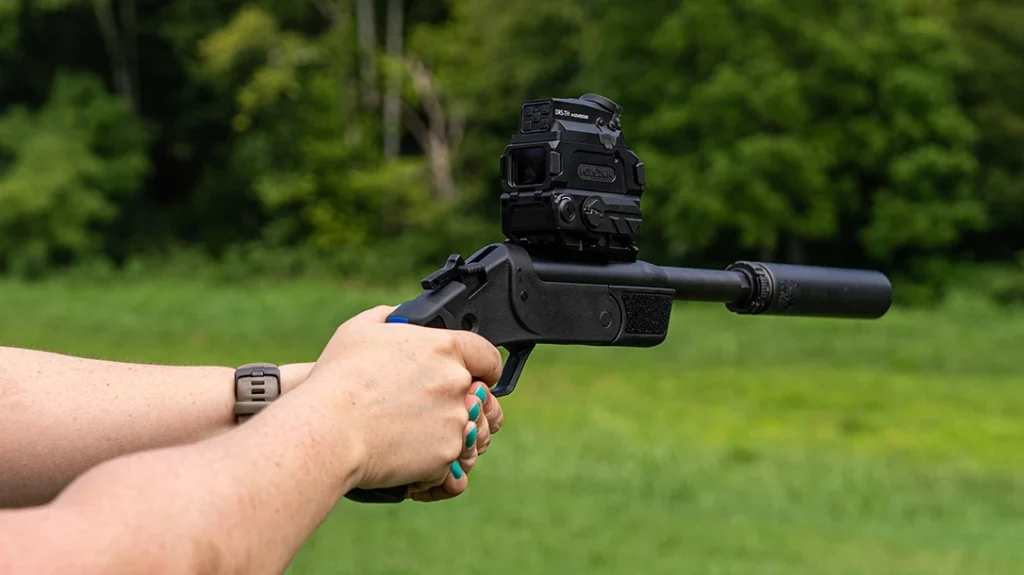 To use the red dot optic and see your target clearly, you will want to open the front lens cover.