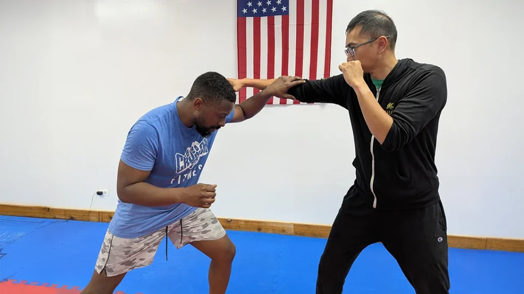Self-Defense Basics: Brian blocks Adam’s punch attempt.