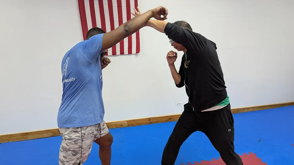 Self-Defense Basics: Adam block Brian’s punch attempt.