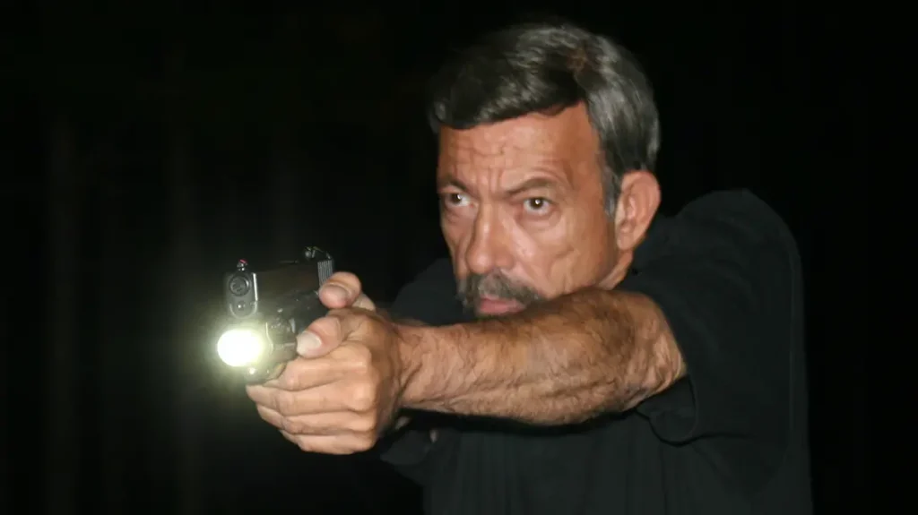 For two-handed shooting, the author recommends the thumb of the support hand to activate the WML.