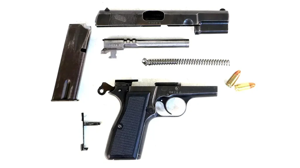 The short recoil action of the Browning Hi-Power shown here went on to drive the vast majority of the combat handguns in the world.